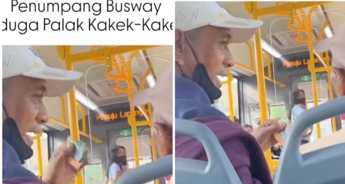 Tangkapan layar pria berjaket merah yang diduga melakukan pemalakan kepa seorang kakek penumpang busway.